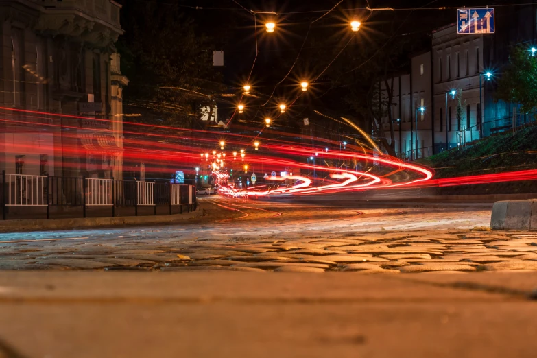 city street at night with a series of lights in motion