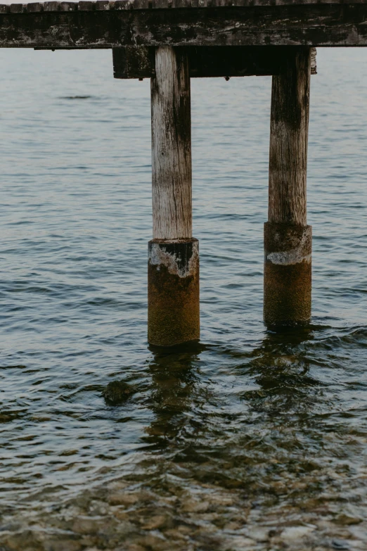 an old pier is submerged in the water