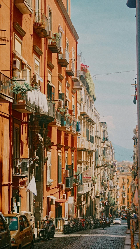 the streets of a city are lined with tall buildings