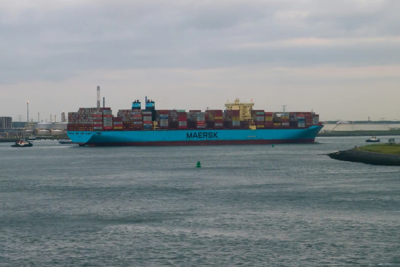 a large container ship is traveling through the ocean