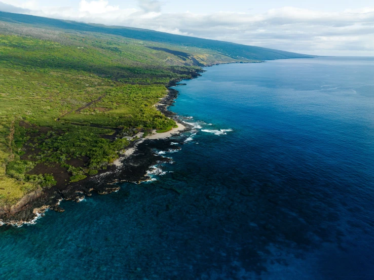 aerial view of island in the middle of ocean