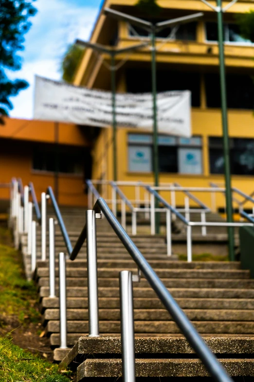 metal railings down the side of some concrete steps