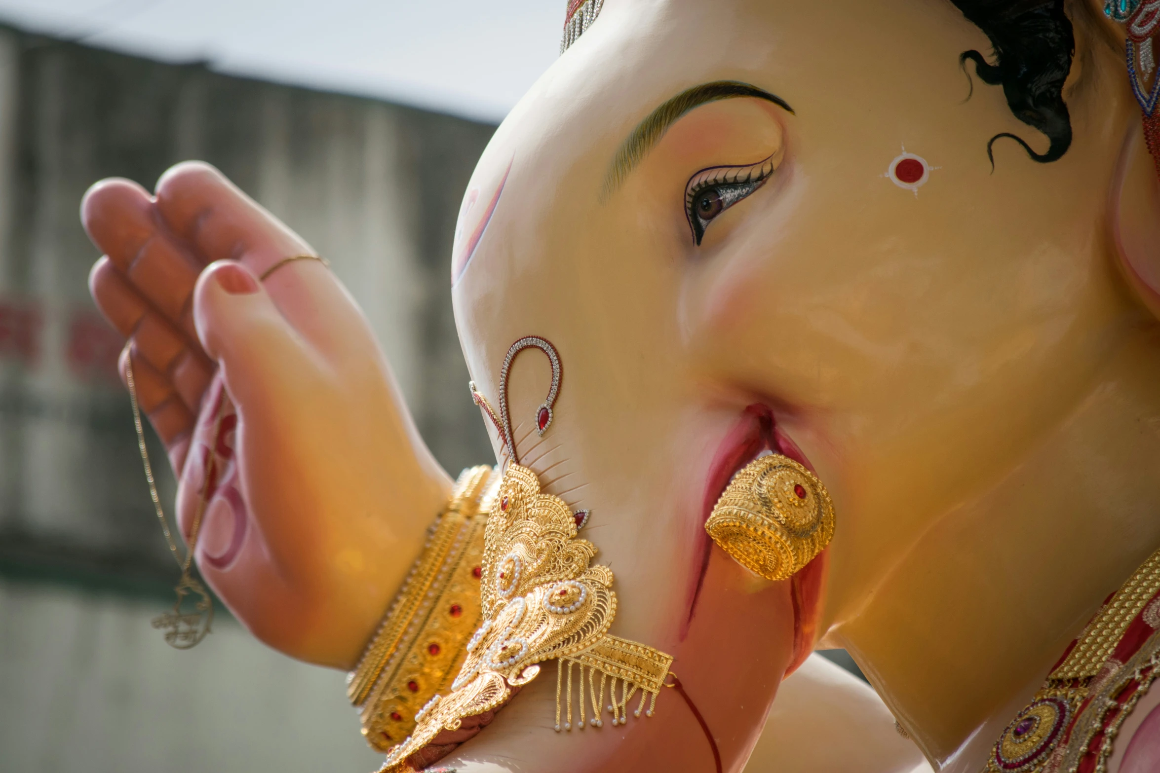 an image of the face and chest of a gan statue