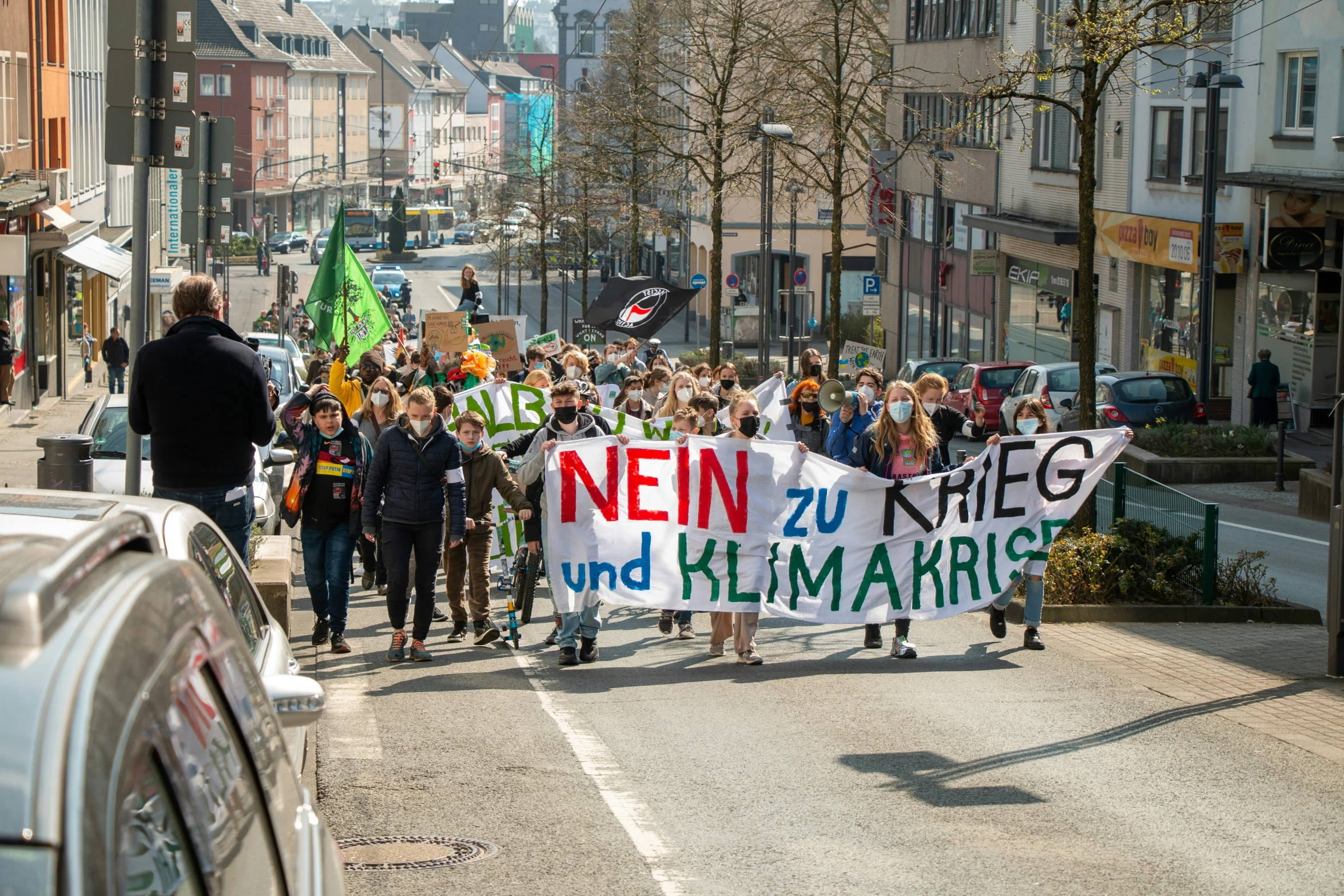 people are walking and protesting in a parade