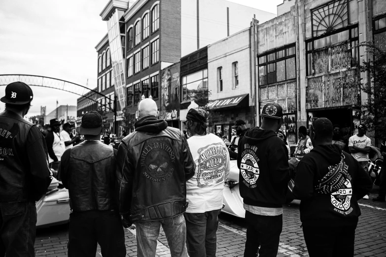 a group of people that are standing in the street