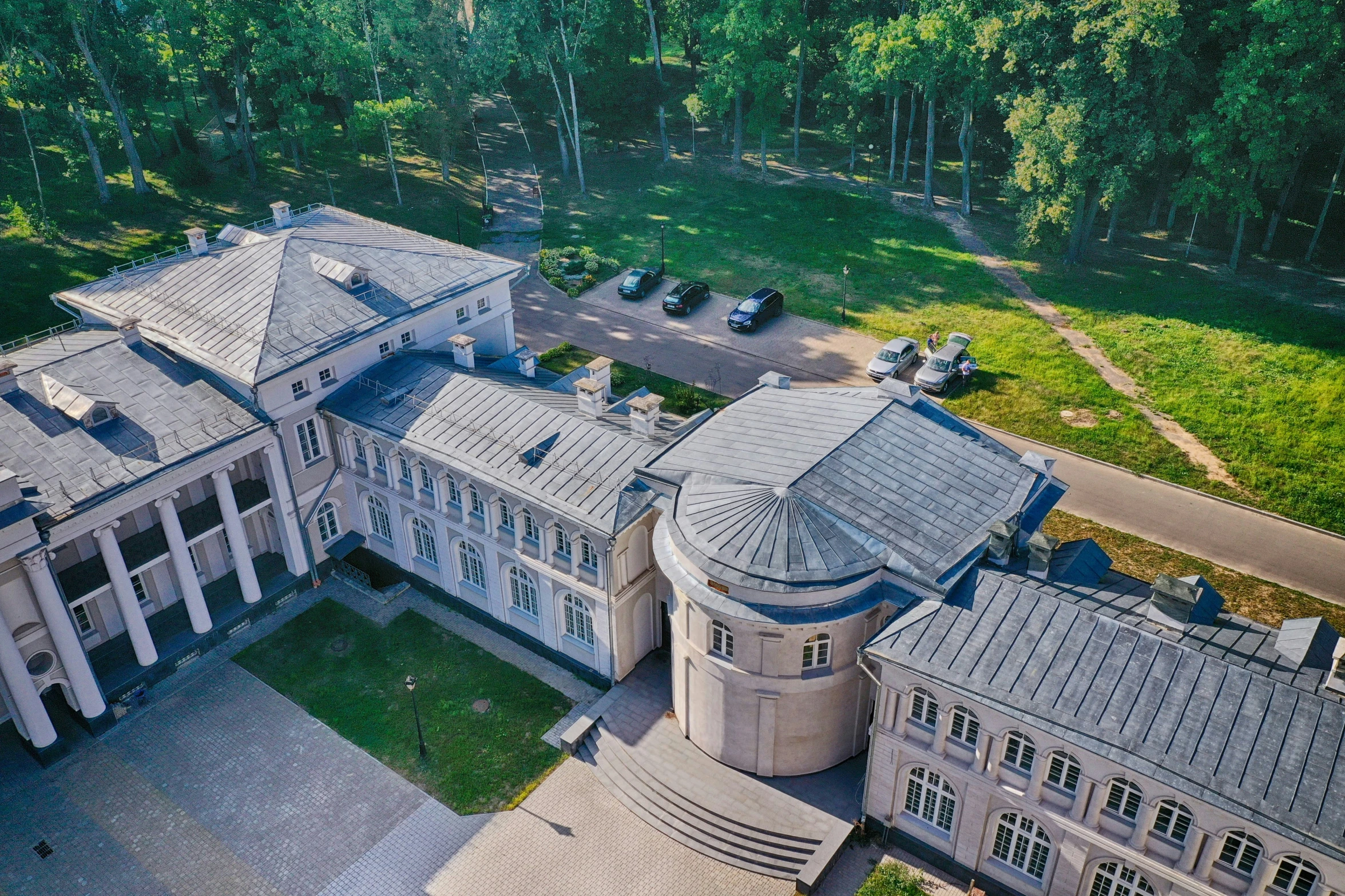 an aerial view of the building with its roof is shown