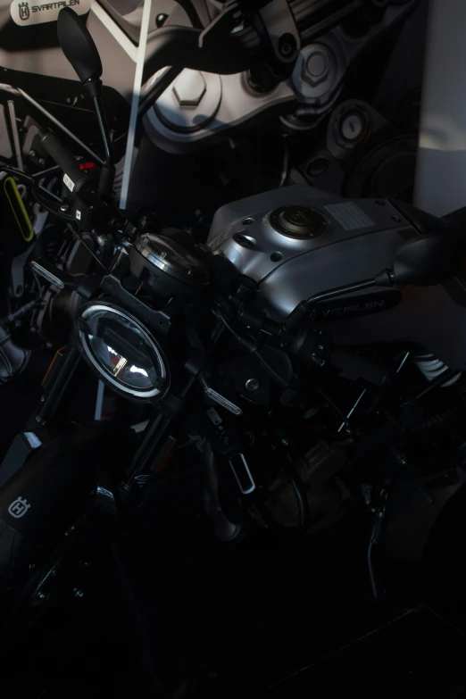 a motor bike is parked next to a chair