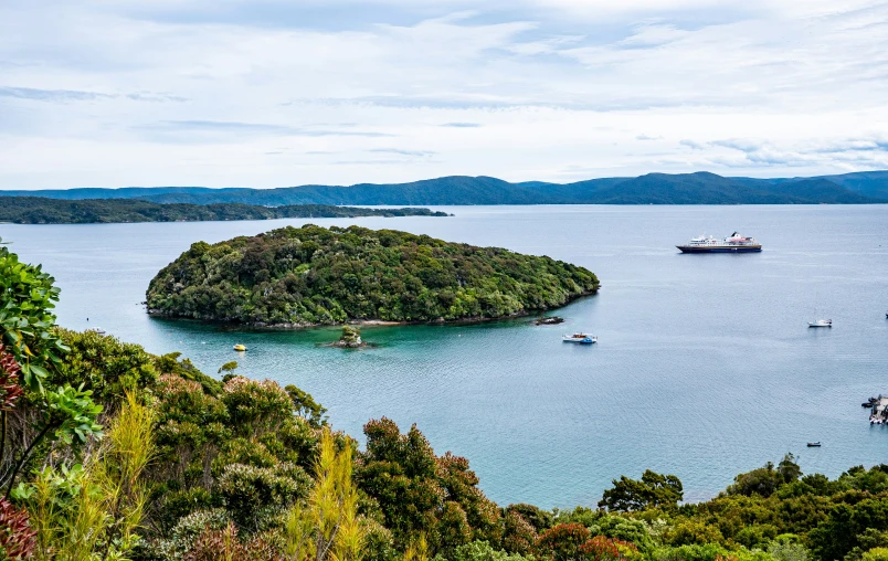 the small island is surrounded by smaller boats