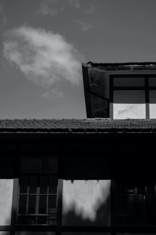 an old building with a very tall roof