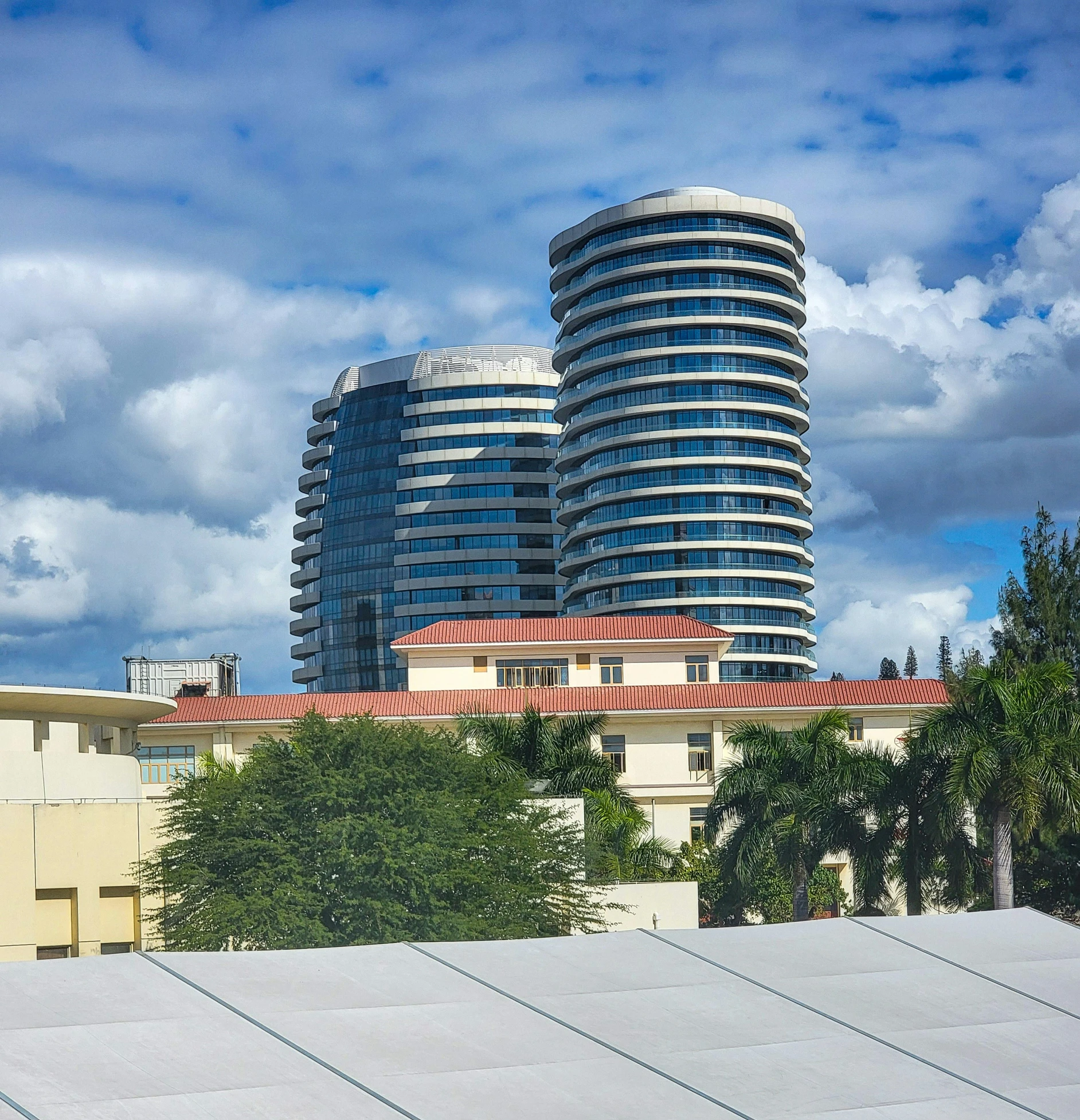 the sky is full of clouds over a building