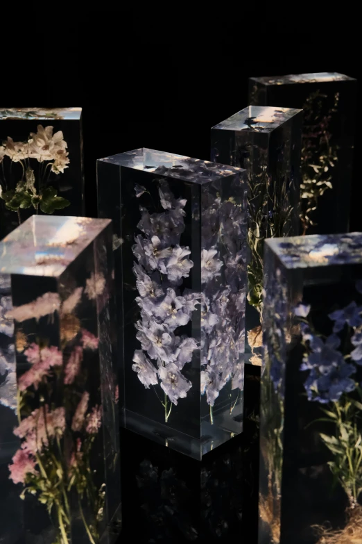 vases made out of glass and floral designs