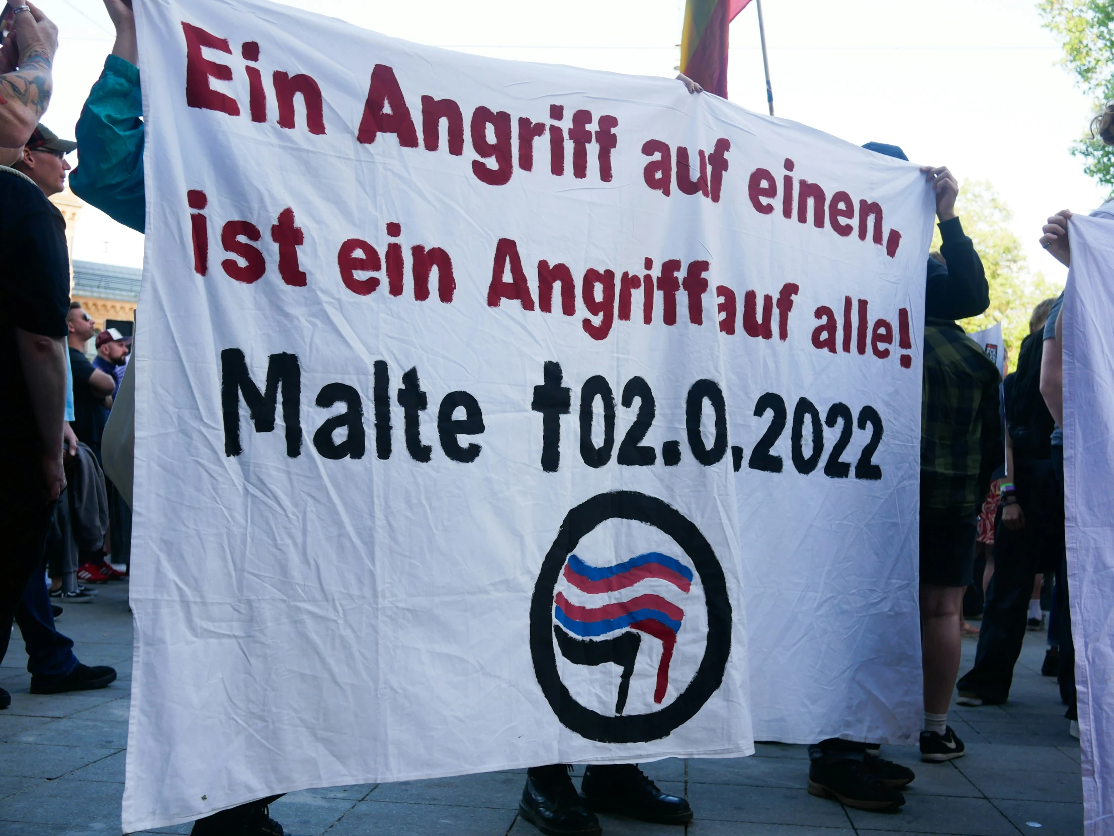 a group of protesters are protesting on the street