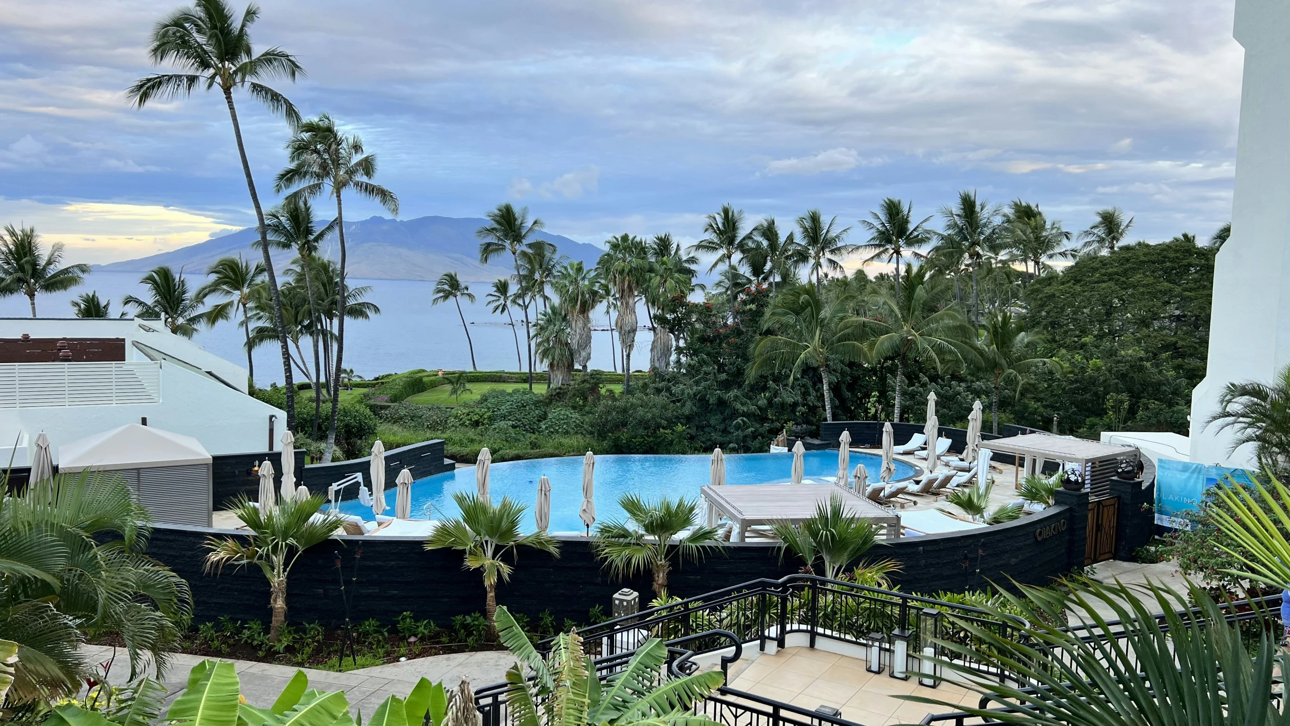 a view from a high rise building showing an outdoor swimming pool