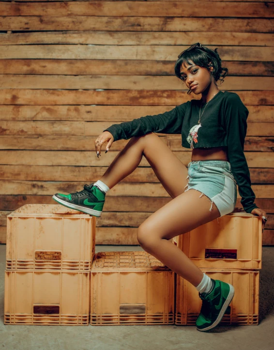 a woman sitting on top of two boxes