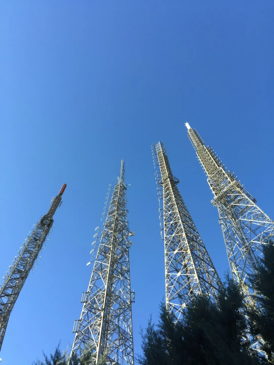 three large towers that are standing in the sky