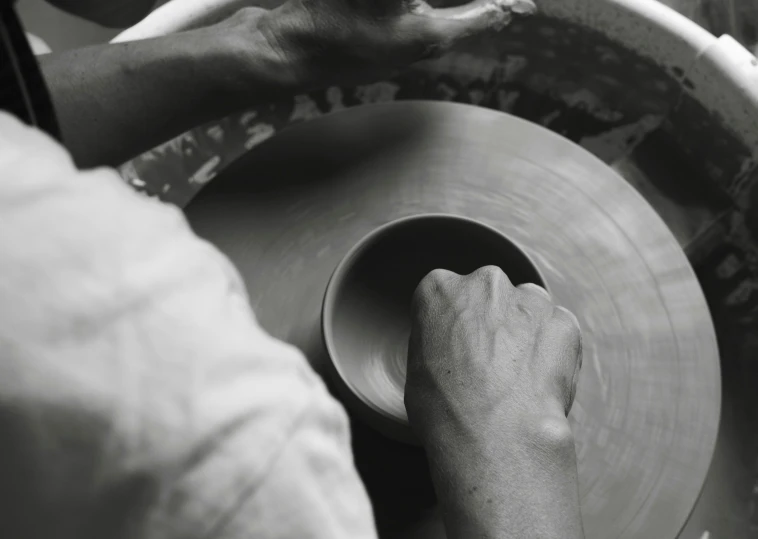 a person using a metal wheel in a machine