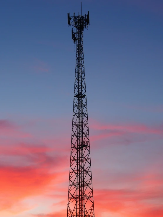 a tower that is tall and has two radio antennas attached