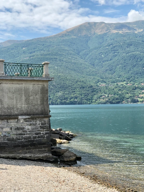 a clock tower by the sea looking over a bay