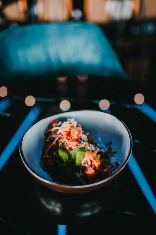 a close up of a bowl of food on a table