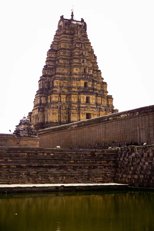 a very tall structure sitting on top of a lake