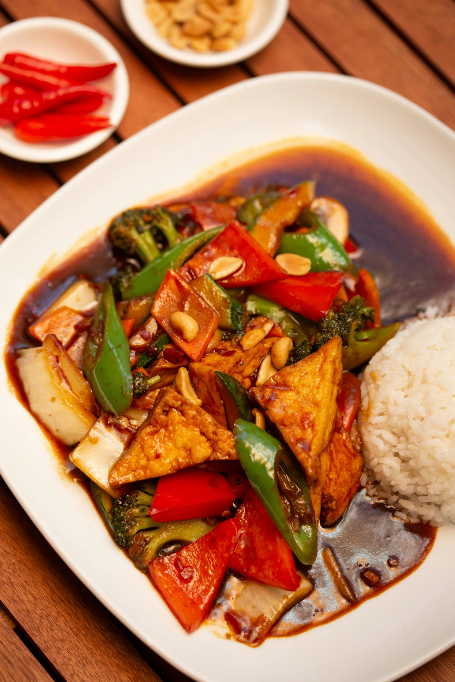 a plate with rice, tofu and vegetables