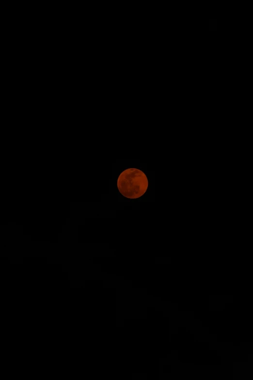 the full moon seen from our window during a black night