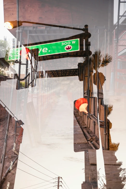 a reflection of a street light and road sign in a dle