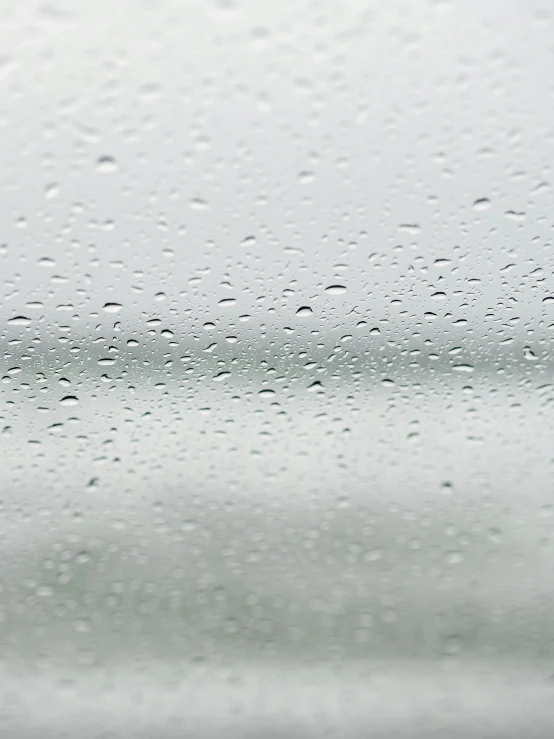 a close up of a rain covered window