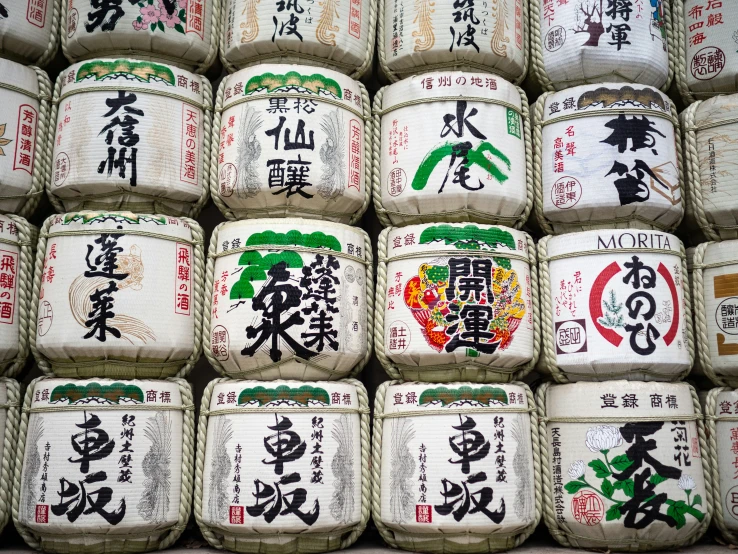 the top row of barrels are piled in rows