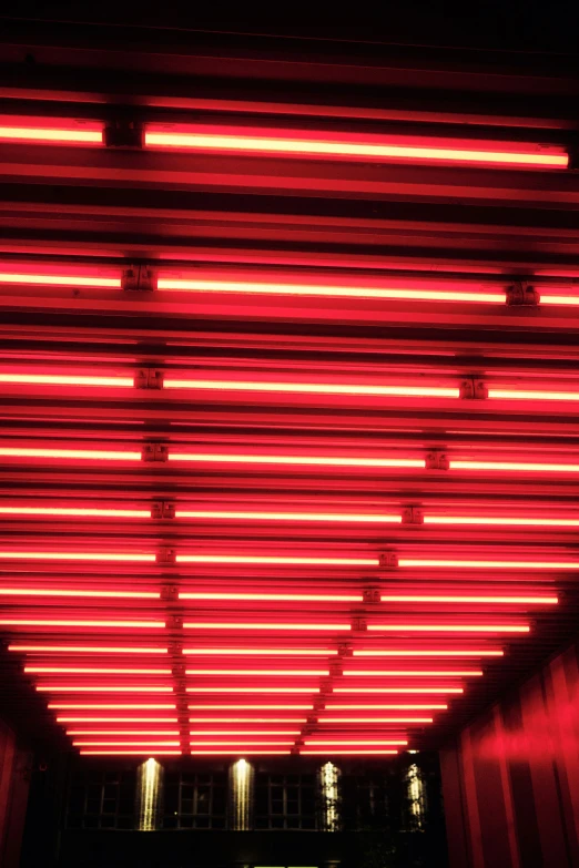 red lights are hanging up on the ceiling