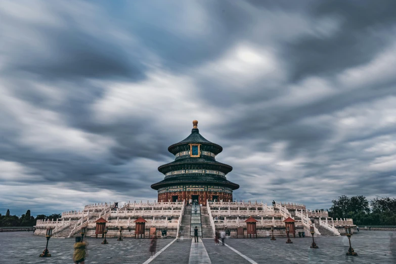 clouds hang over a building on a cloudy day