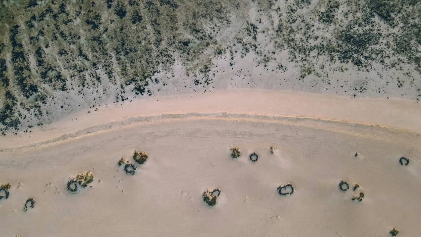 a aerial s of an empty beach near the ocean