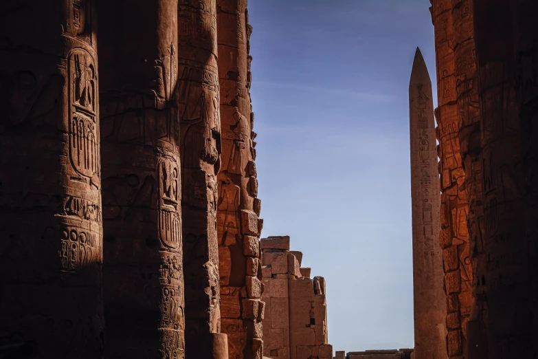 looking between the two columns of a large temple in egypt