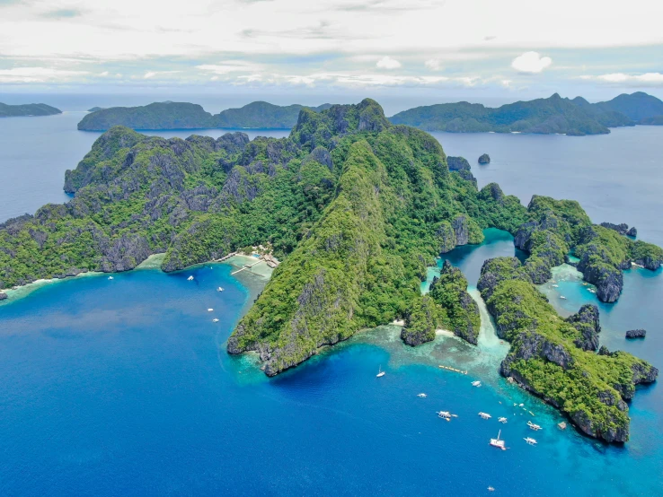 an island in the middle of blue water