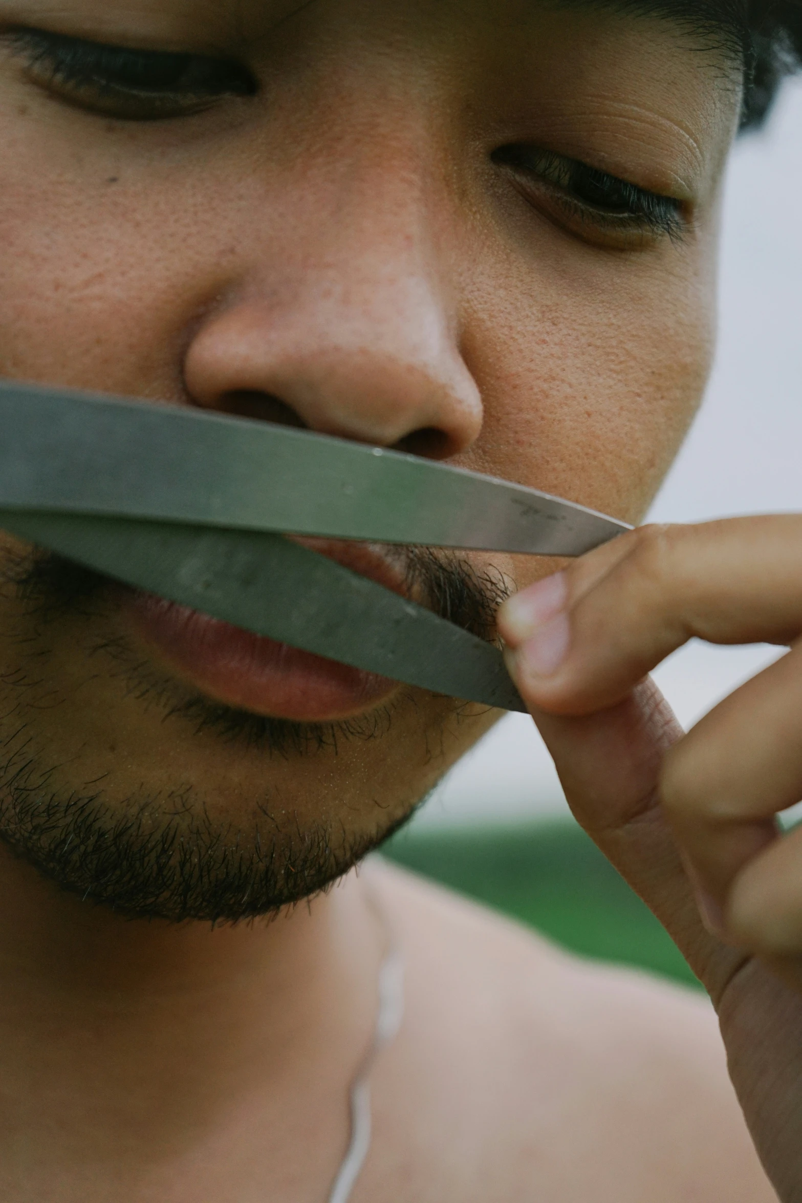 a close up of a person  soing with scissors