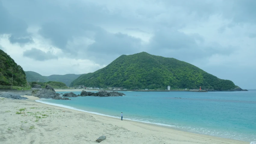 an image of a white sand beach on the ocean