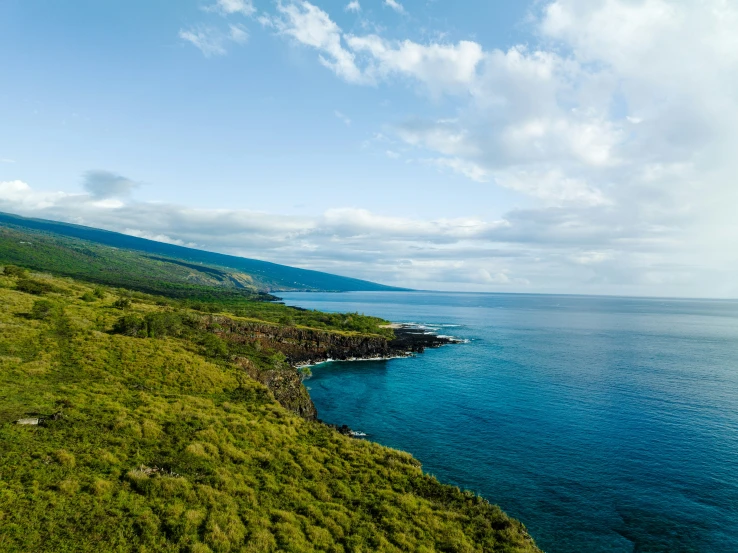 the view from a very high hill overlooking a body of water