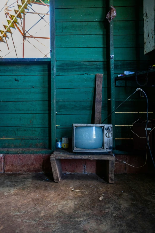 a tv is in the room with some wood