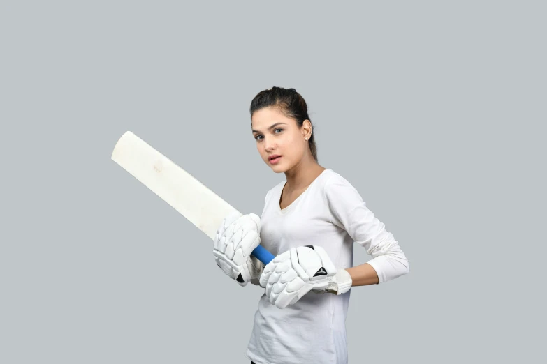 a woman holding a white baseball bat on a gray background