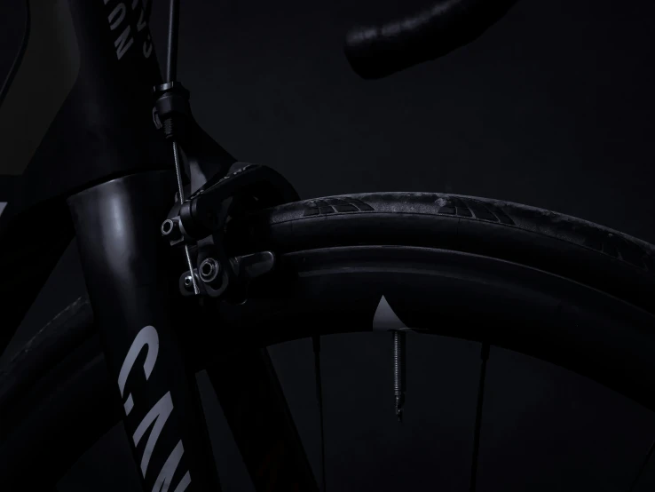 a bike is shown in black and it has spokes