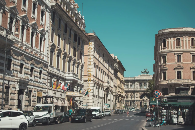 cars and buildings lining a narrow city street