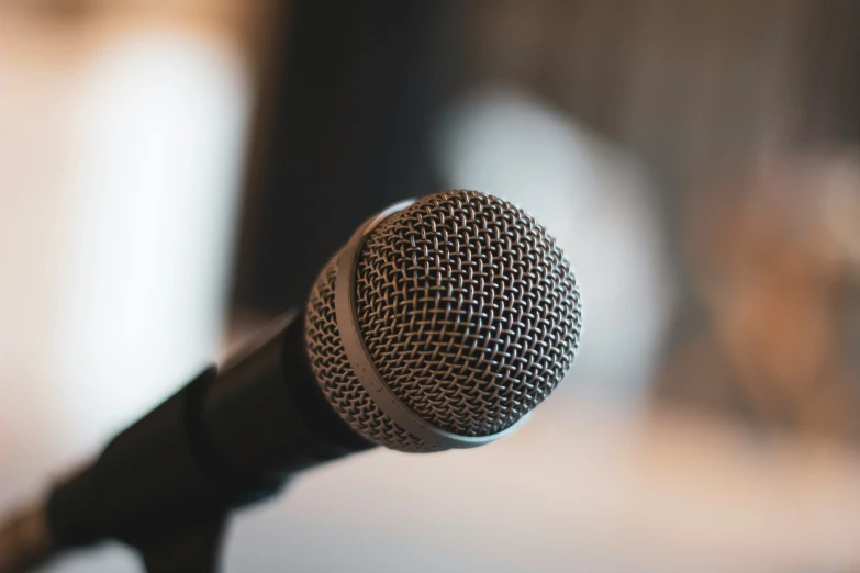 a microphone with it's cord still attached, to look as if it are an old microphone