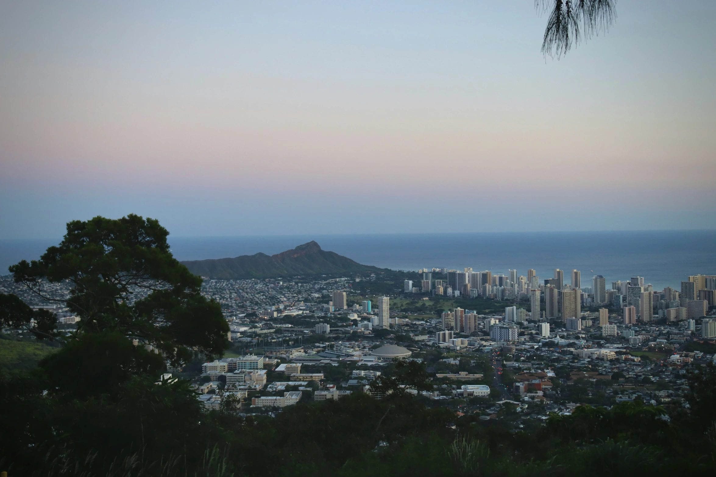 a big city with some buildings near the ocean