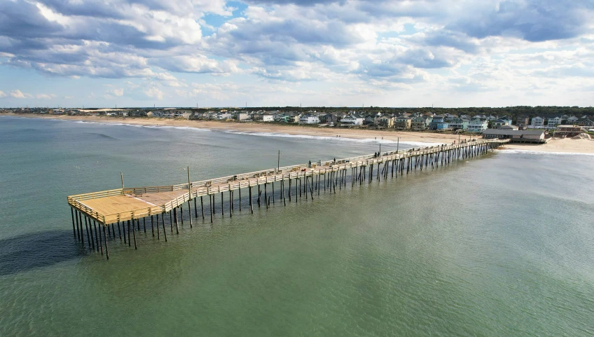 a pier sits empty on a large body of water