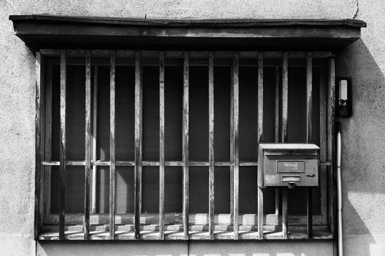 a  cell with bars and the door locked