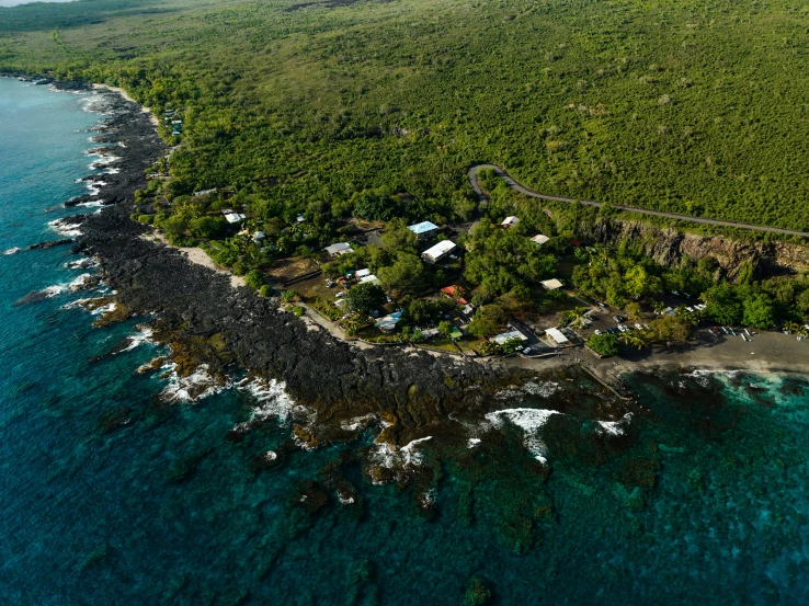 aerial view of small village on an island with water surrounding it