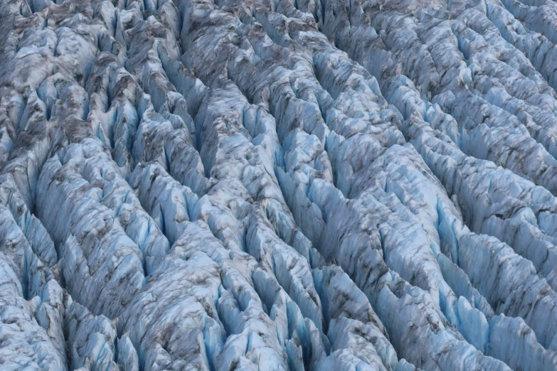 a massive glacier with many glaciering formations