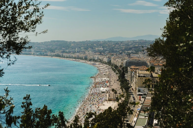 a city view with the beach at the end of the road