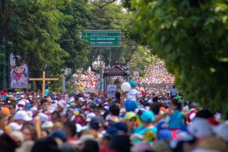 a huge crowd of people stand in a row