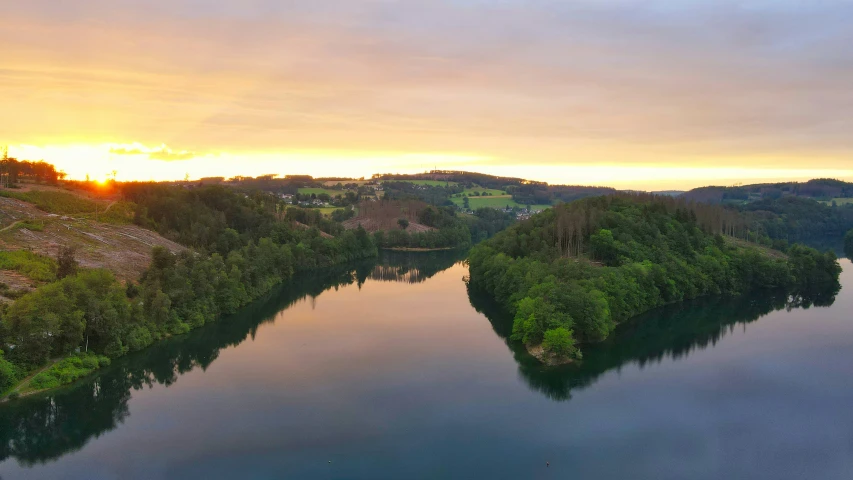 a view of a river with trees in the background